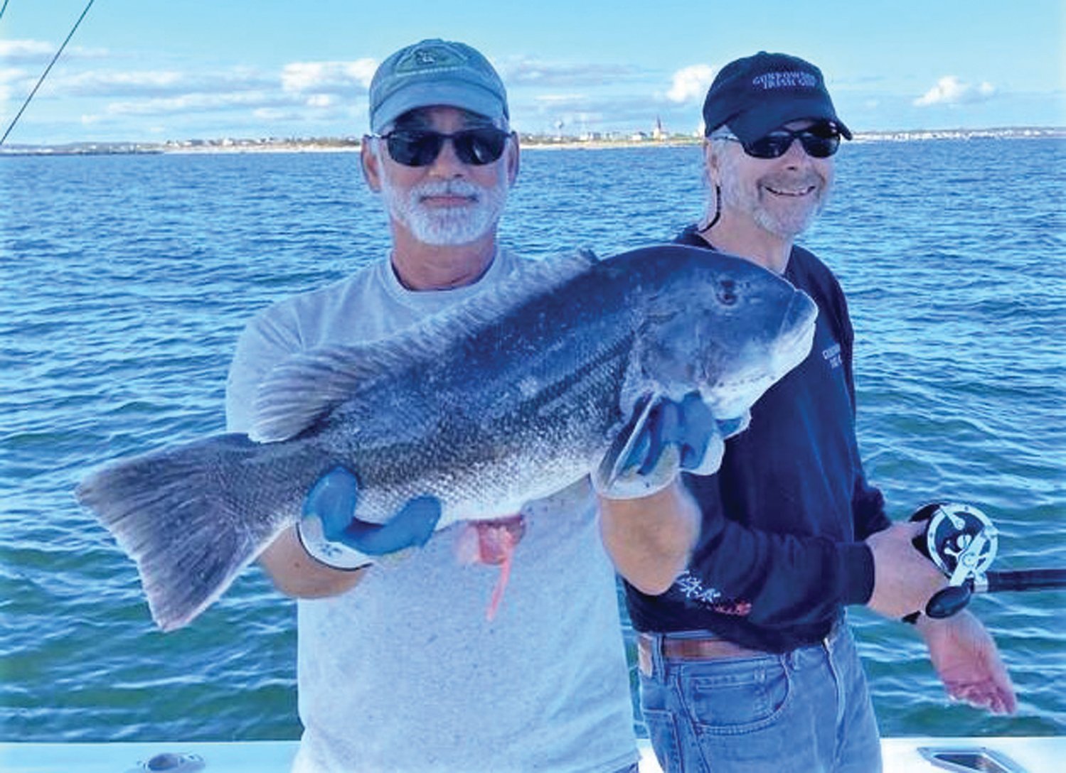 BIG CATCH: John Stavrakas of South Kingstown with the 22-inch, seven-pound tautog he caught off Pt. Judith last week with his friend John Jeffries of Fort Salonga, NY.